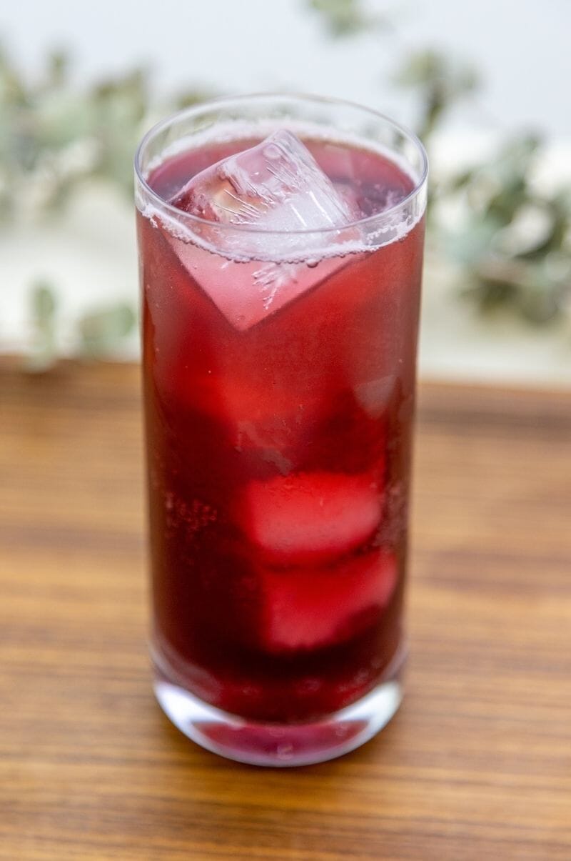 Flowering Schisandra Berry Spritz in a tall glass.