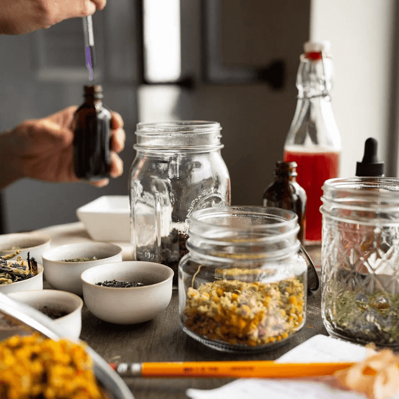 Jars of botanicals on table