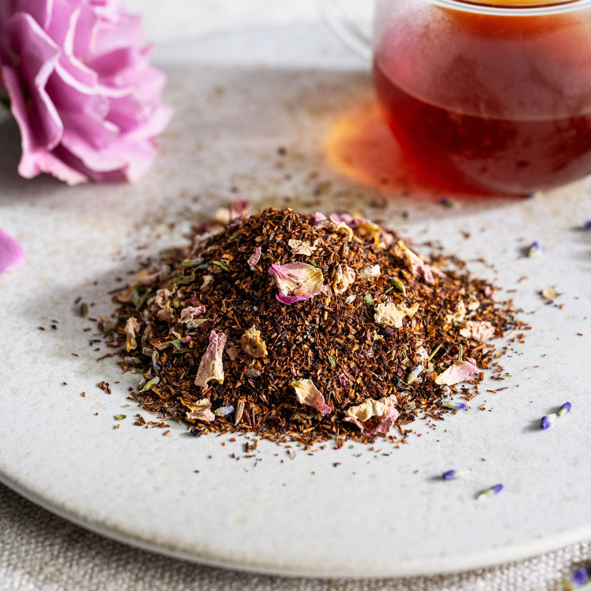 Bergamot Rose tea from Rishi Tea & Botanicals on a white plate with a cup of tea.
