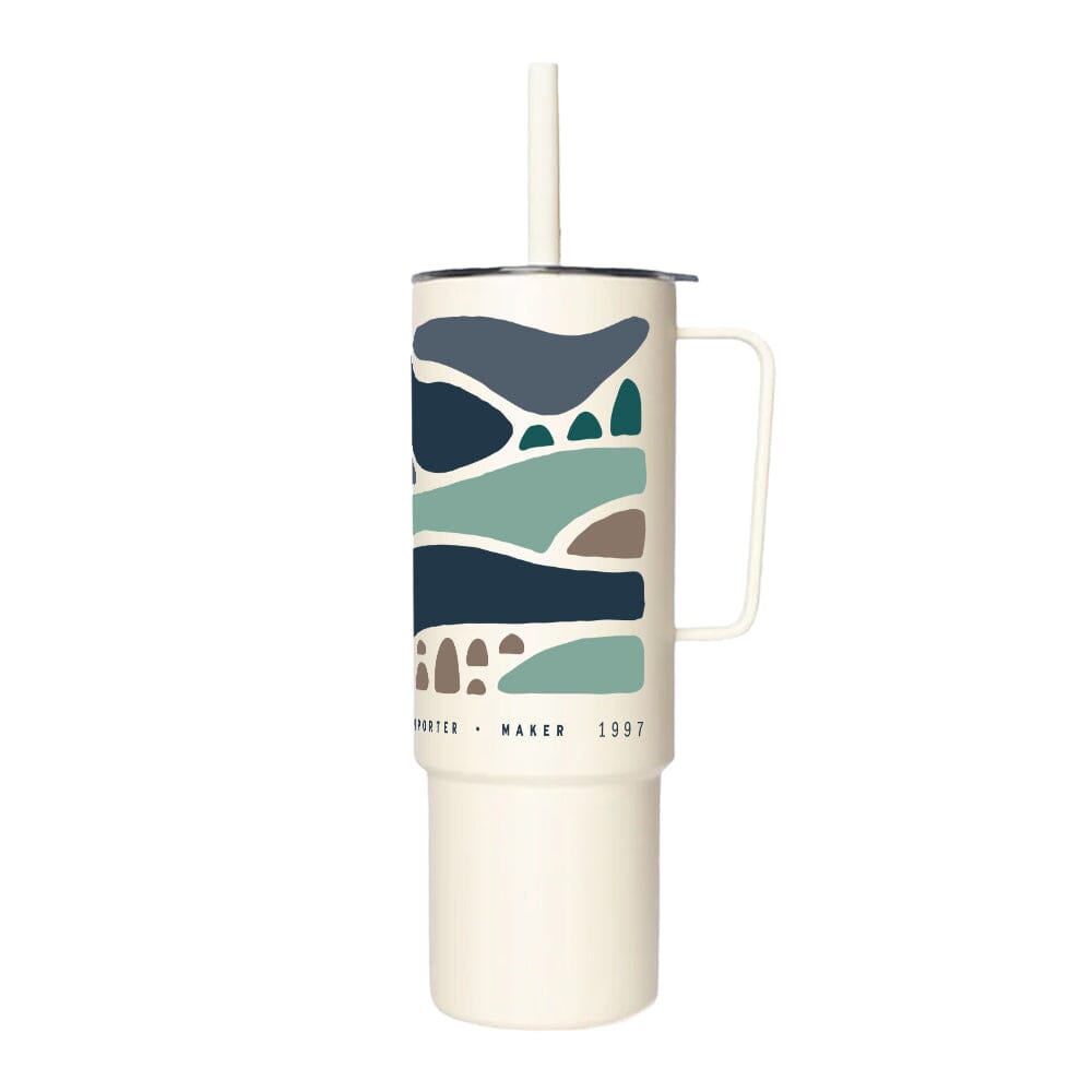 The Rishi x Miir All Day Straw Cup by Rishi Tea & Botanicals is a white insulated tumbler with a handle and straw, featuring an abstract landscape design in shades of blue, green, and beige. Crafted from BPA-free stainless steel, it boasts the text "Kritter Maker 1997" printed at the bottom.