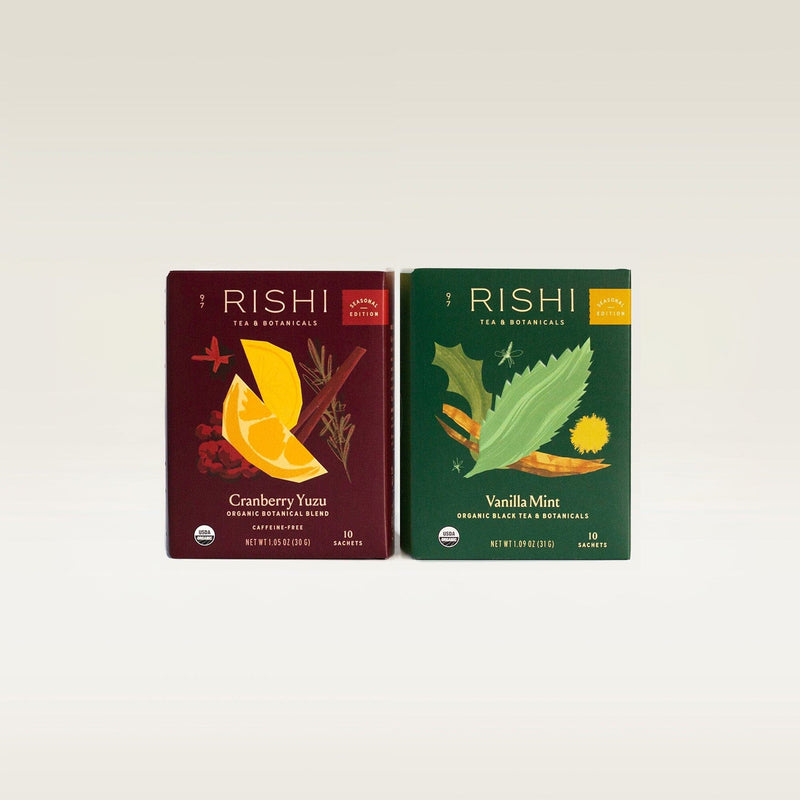 Two boxes of Rishi Tea & Botanicals organic blends are shown side by side: Cranberry Yuzu and Vanilla Mint, each containing 15 sachet tea bags.