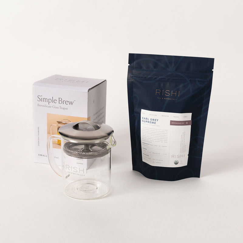 The Earl Grey Supreme & Simple Brew Set by Rishi Tea & Botanicals includes a Simple Brew teapot, along with a box labeled "Simple Brew" and a bag of Rishi Earl Grey Supreme loose leaf tea.