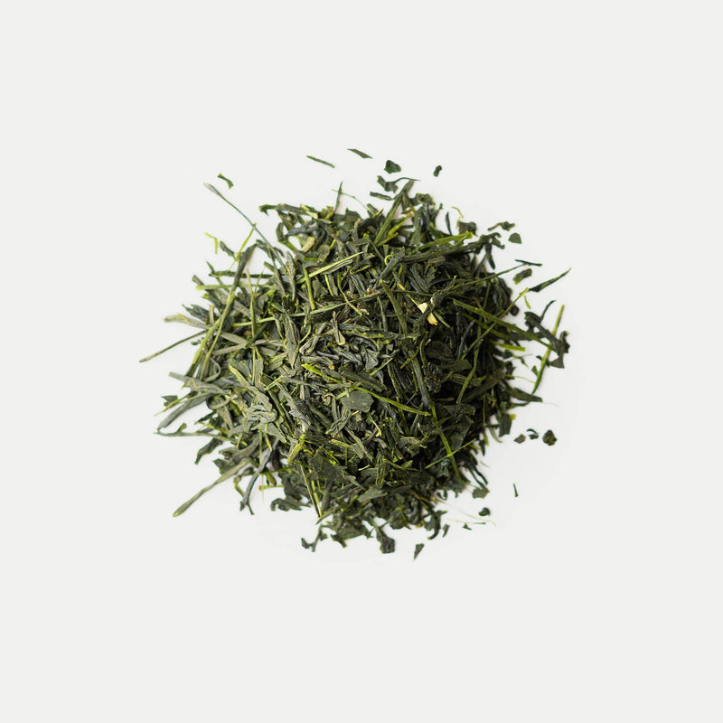 A small mound of loose-leaf Shizuoka tea from Rishi Tea & Botanicals rests on a plain white background.