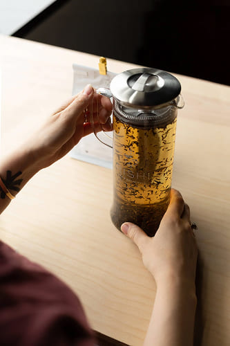 Preparing to put freshly brewed tea in the refrigerator